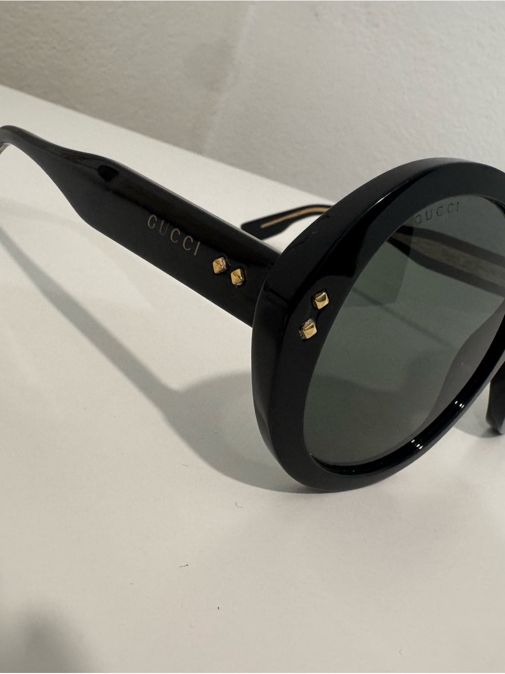 Gucci Black Round Sunglasses with Gold Stud Accents